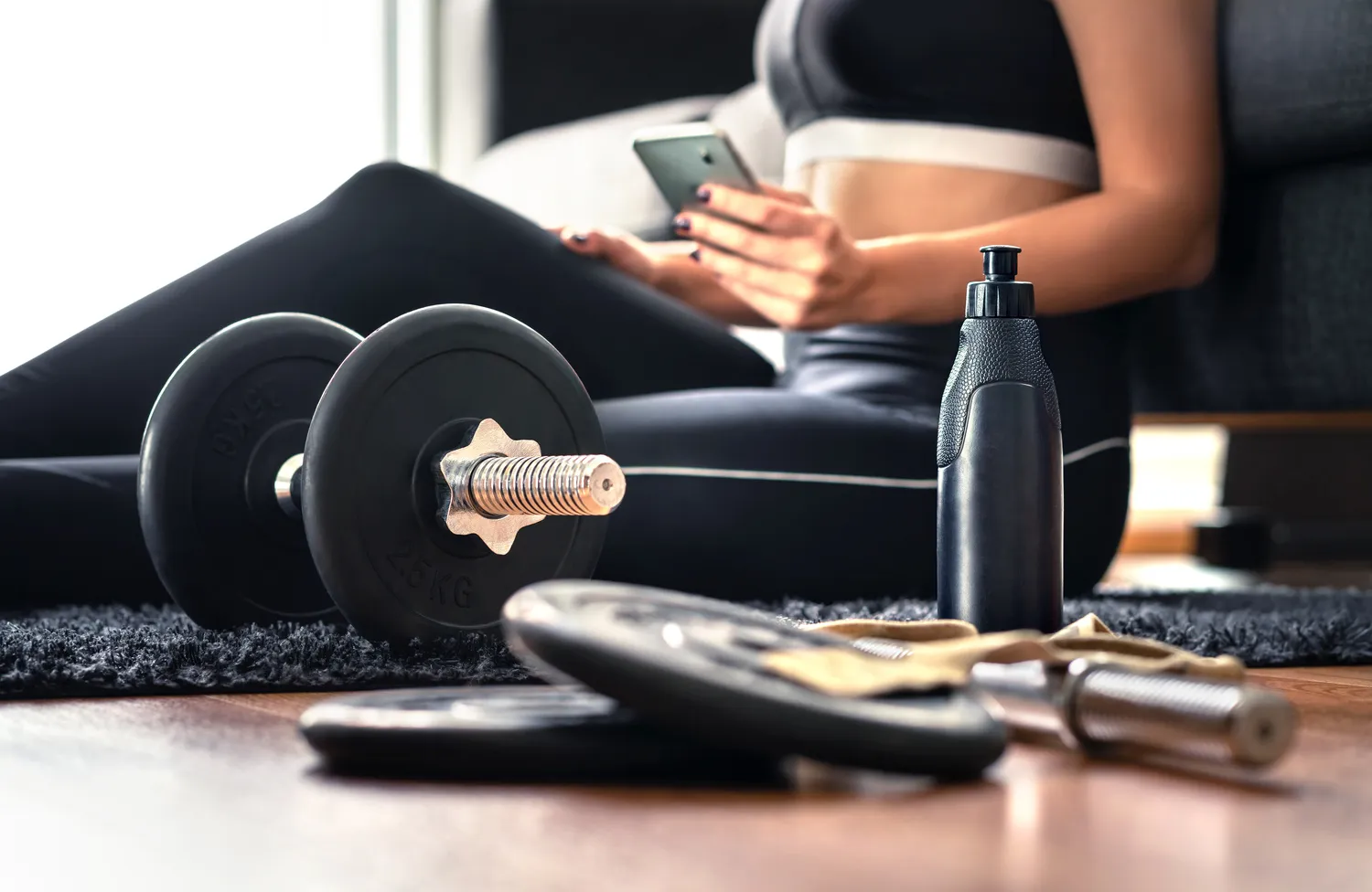personal trainer guiding client in home training