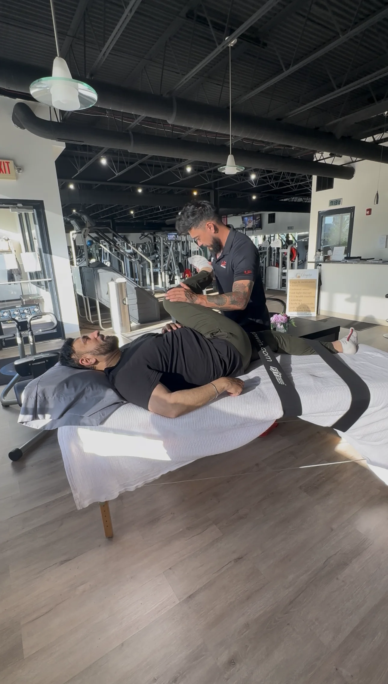 athletic client getting post-training sports massage session